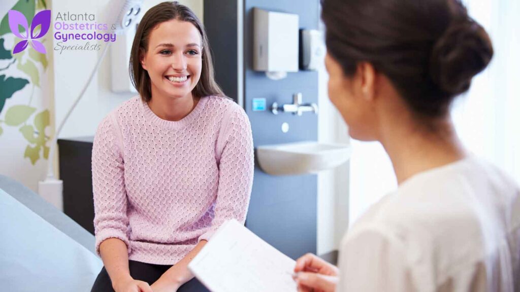 A woman in a medical office having a detailed discussion with her OBGYN.