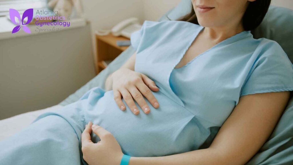 A pregnant woman resting in bed as she prepares for delivery.