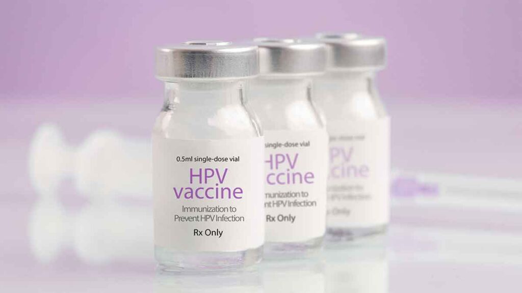 Three HPV vaccine vials on a clean surface