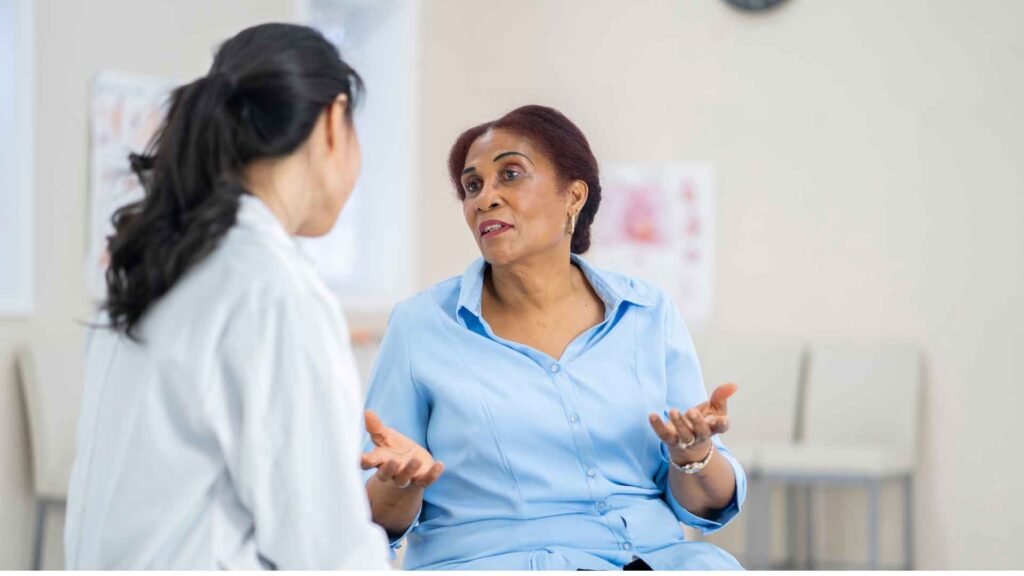 A woman having a consultation with her OBGYN during a medical appointment