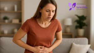 A woman looking concerned due to abdominal discomfort