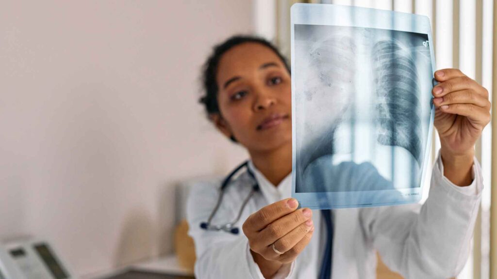Female OBGYN examining scan results in a clinic