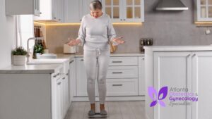 A woman standing on a weighing scale